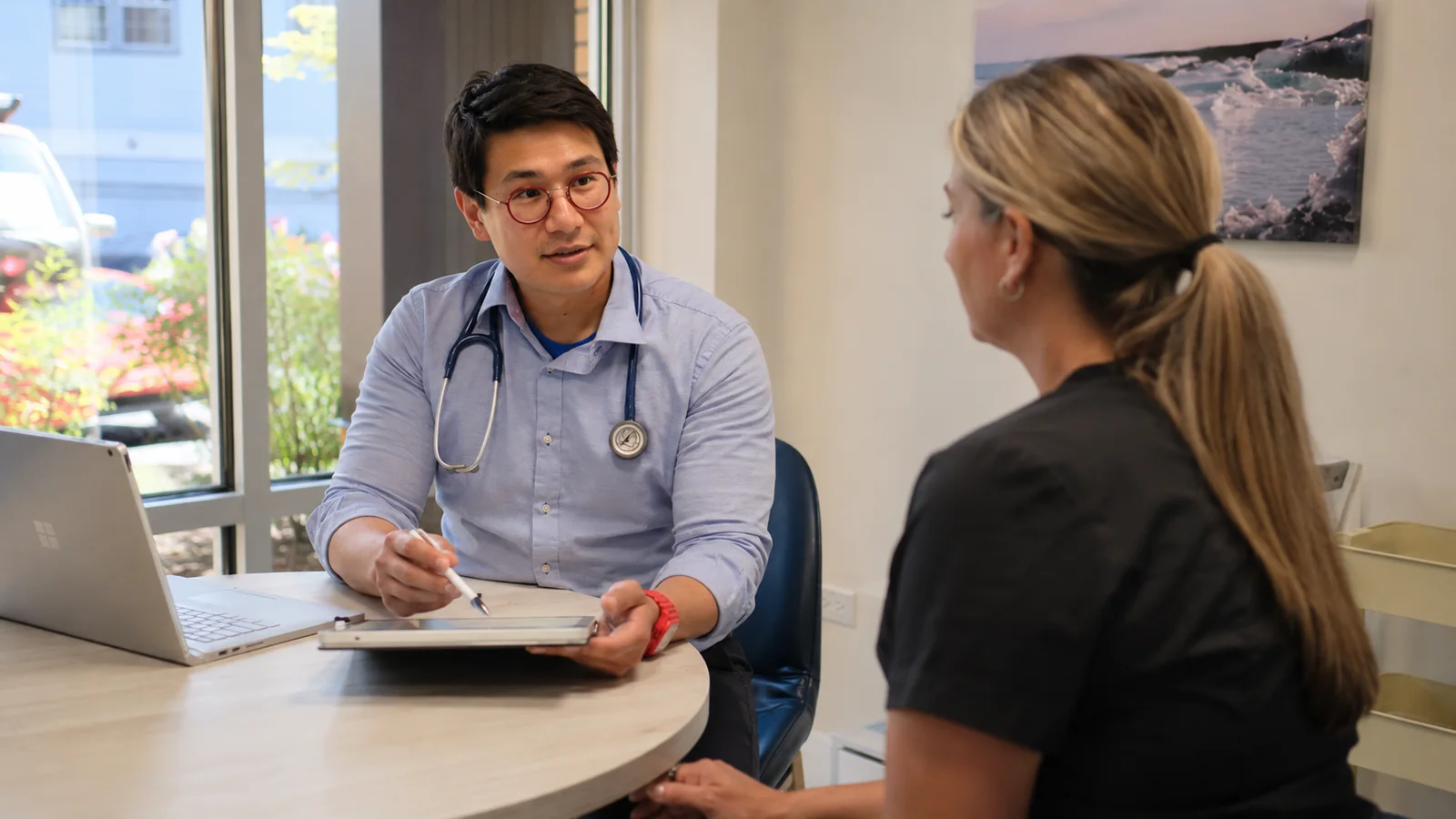 Occupational medicine provider coordinating an injured worker referral in the Puget Sound region